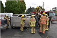 Firefighters by Flipped-Over Car