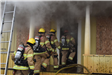 Firefighters going into Smoking Doorway