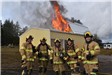Firefighters in front of Burning Building