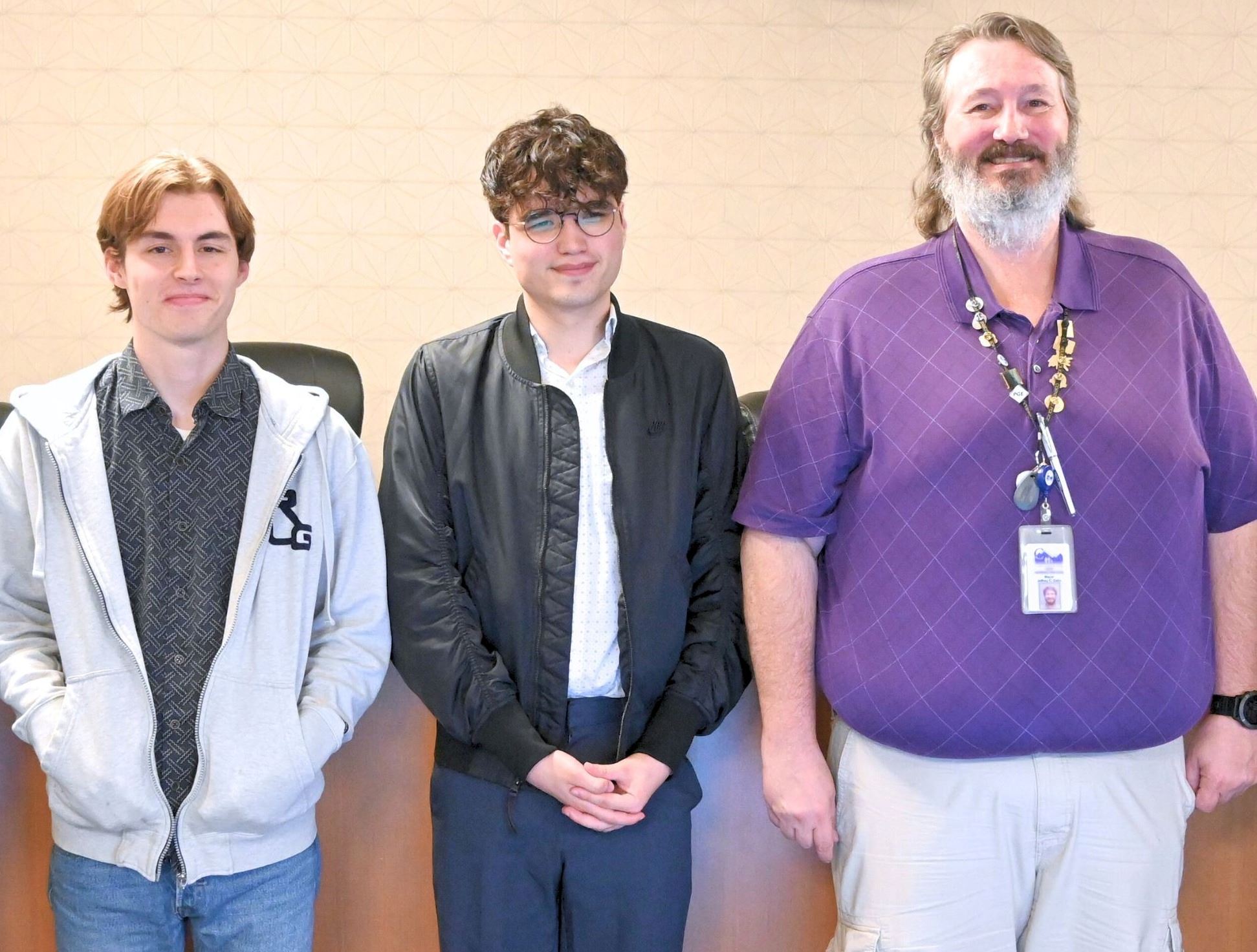 Commissions Owens and Baker pose with Mayor Dalin after being appointed by the City Council.