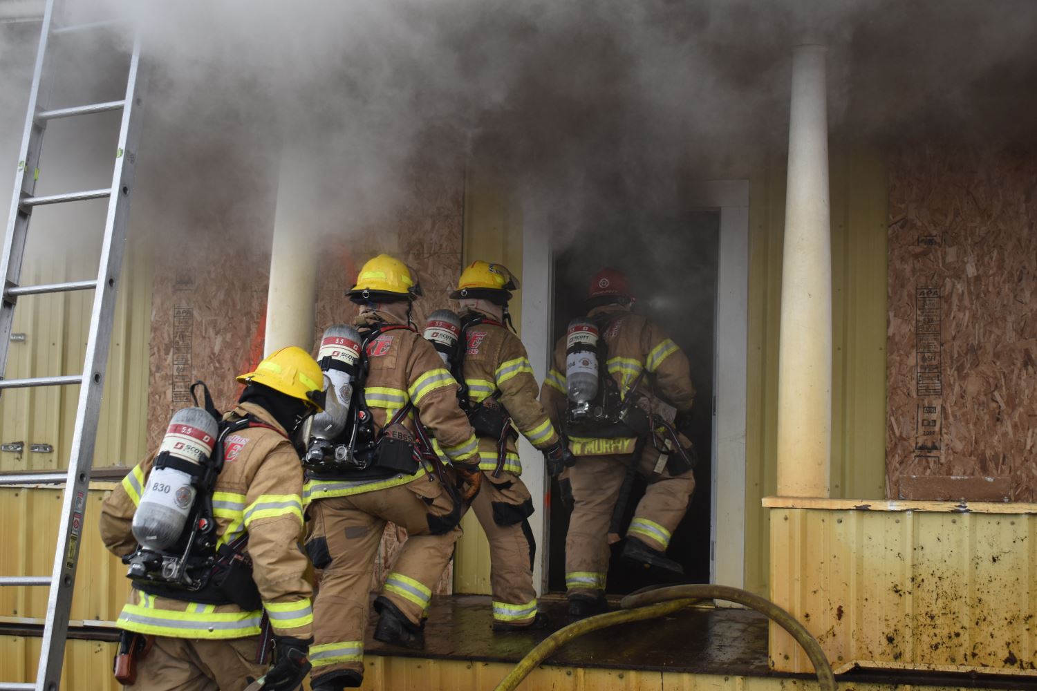 Firefighters going into Smoking Doorway
