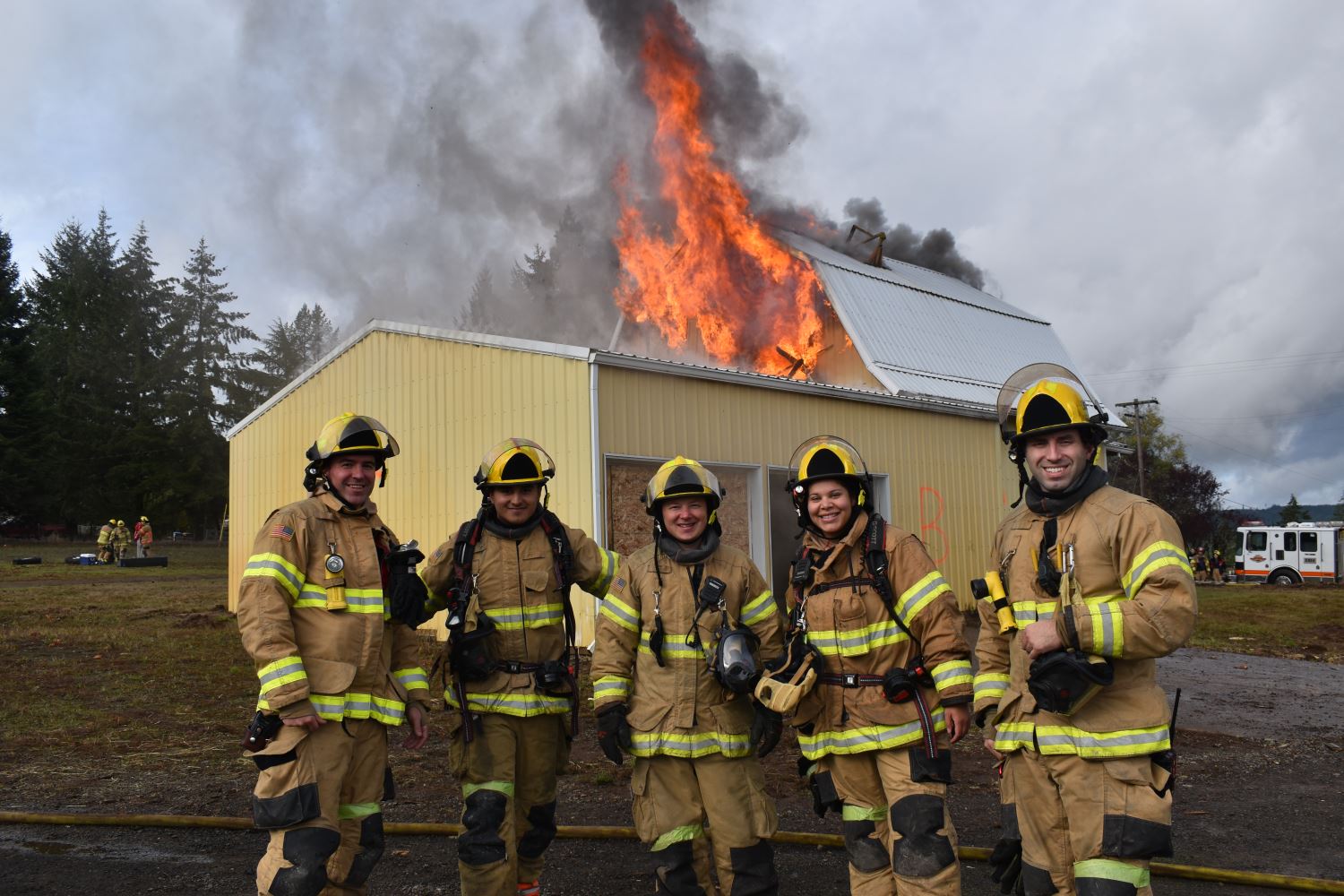 Firefighters in front of Burning Building