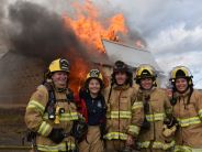 Firefighters small Group Photo in front of Burning Building