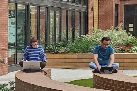 People on Laptops Outside