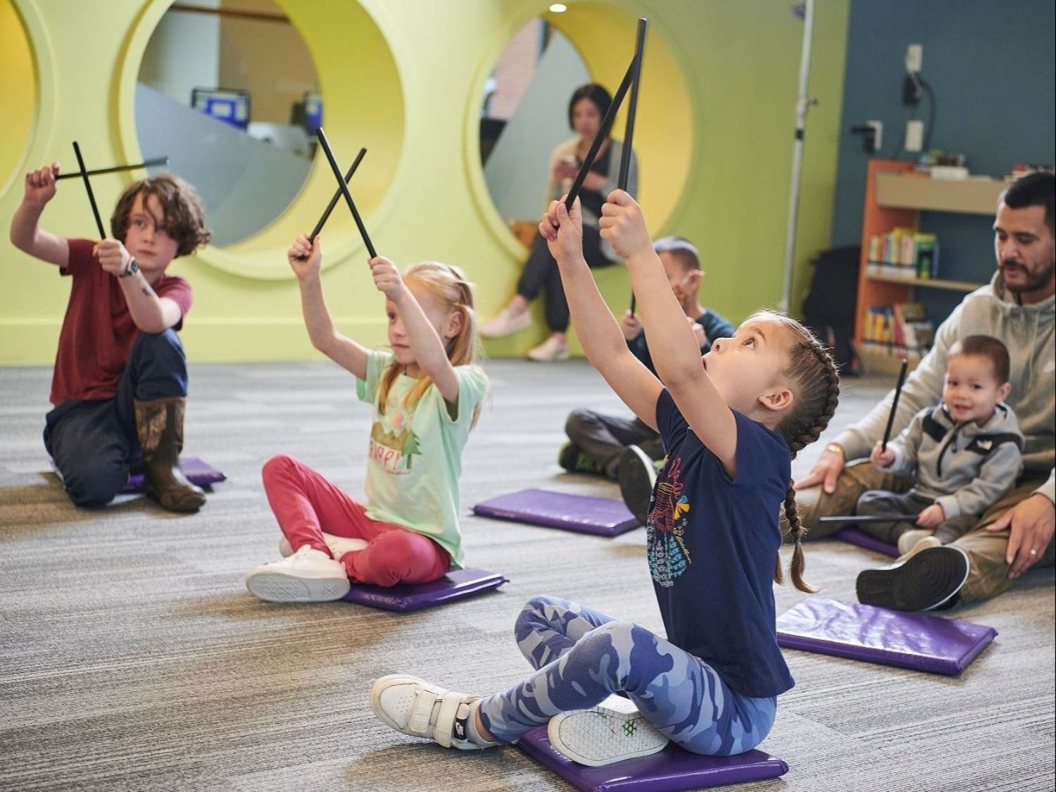 Children Playing Stick Instrument