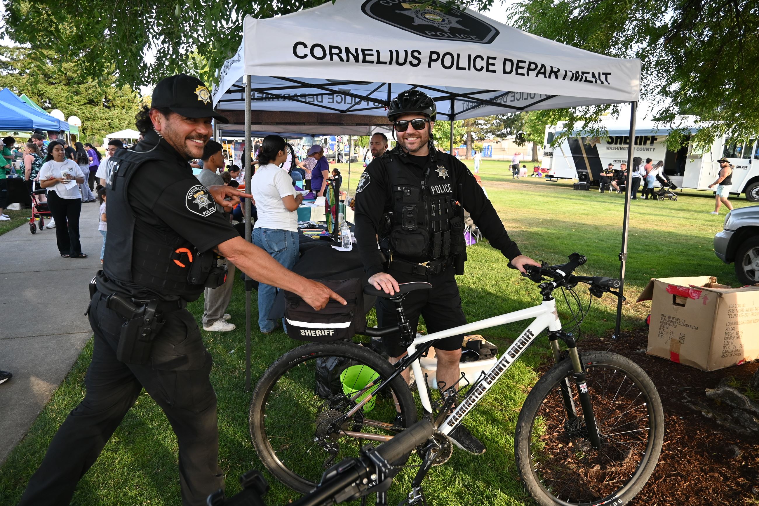 Two deputies pointing at new bike