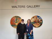 Pyrographer and Mixed Media Artist Luis Jiménez with LibraryDirector Karen Hill in the Cornelius Library's Walters Gallery